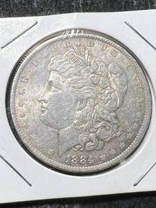 lot 21 image: 1884-O US MORGAN SILVER DOLLAR