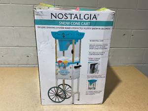lot 229 image: Nostalgia Snow Cone Shaved Ice Machine - Retro Cart Slushie Machine Makes 48 Icy Treats 48 Tall - Includes Metal Scoop, Storage Compartment, Wheels for Easy Mobility - White, Blue
