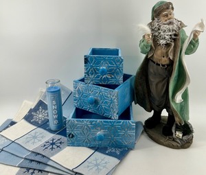 lot 30 image: Winter Holiday Decor Lot Snowflake Placemats, Let It Snow Candle, Blue Boxes and Santa