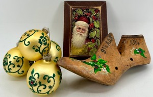 lot 86 image: Vintage Painted Western Last Co Shoemaking Wood Form & Framed Santa Print & Gold Christmas Ornaments
