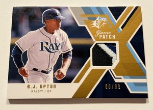 lot 28 image: BJ Upton 4-Color Patch 99 2009 Upper Deck SPx Game Patch #GJ-BU Numbered 6099 Baseball Card