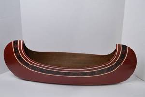 lot 127 image: Decorative Wooden Canoe Centerpiece with Red and Black Accents, 28 in.