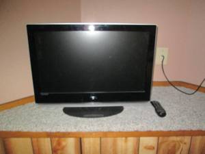 lot 64 image: Vizio 26in flat screen TV with remo...