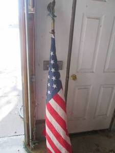 lot 383 image: American flag on 5ft pole with eagl...