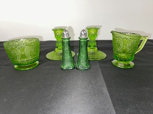 lot A-63 image: Set of Green Depression  Glass Tableware with Candlesticks, Creamer, Bowl, and Shakers
