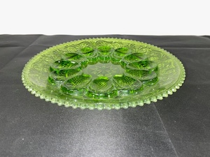 lot A-68 image: Green Pressed Glass Deviled Egg Plate with Decorative Pattern, 11 Inch