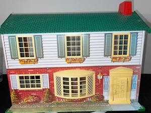 lot 75 image: Wolverine Vintage Tin Dollhouse with Plastic Windows and Doors