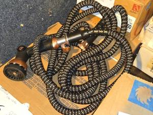 lot 562 image: Pocket Garden Hose with Spray Nozzle