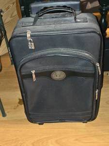 lot 703 image: Lewis & Hyde Rolling suitcase