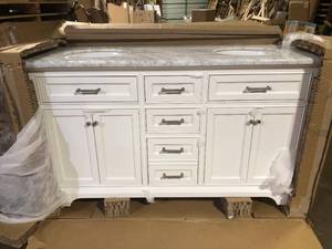 lot 16 image: Home Decorators Collection Windlowe 61 in. Double Sink White Bath Vanity with White Carrara White Marble Top (Assembled)  Broken on Corner   Customer Returns See Pictures