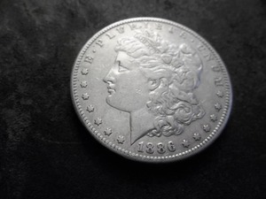 lot 5 image: 1886 S Morgan Silver Dollar