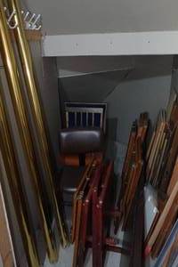 lot 210 image: Contents of Crawlspace - Banquet Table, TV Trays, Folding Chair