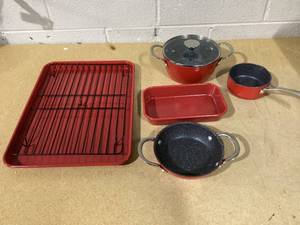 lot 313 image: Curtis Stone 7-piece Dura-Pan Nonstick Stacking Cookware Set (Red) MSRP 285 (ONLY 7 OF THE 14 PC)
