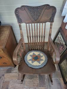 lot 87K image: Antique Wooden Rocking Chair with Carved Back and Cushion