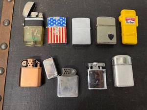 lot 42B image: Collection of 9 Vintage Lighters Including Zippo, Champ, and Marlboro