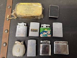 lot 43B image: Collection of Vintage Lighters and Life Raft Tablet Ration Tin