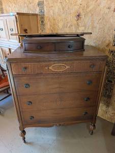 lot 35 image: Antique Wooden Chest of Drawers with Decorative Trim and Caster Wheels