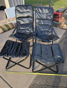lot 165 image: Pair of Black Padded Leather Folding Glamping Lounge Chairs with Ottomans