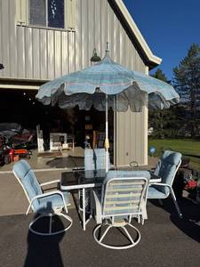 lot 114 image: Patio Dining Set with 4 Cushioned Chairs, Glass Table, and Umbrella