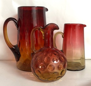 lot 34R image: MB - Two Vintage Amberina Glass Pitchers and One Vintage Coin Dot Amberina Cruet
