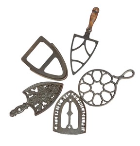 lot 164R image: MB - Collection of 5 Vintage Cast Iron Trivets with Various Designs