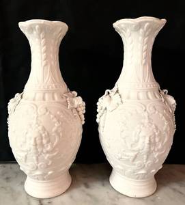 lot 143C image: LR - Pair of 8.5 Inch White Bisque Porcelain Vases with Ornate Relief Design