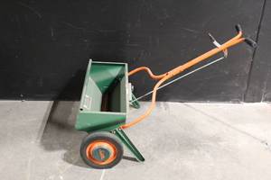 lot 43 image: Scotts Model 75-8 Broadcast Spreader with Orange Handle