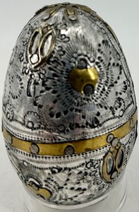 lot 235 image: Milagro Prayer Egg - Silver and Brass Embossed Egg with Ornate Design