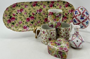 lot 262 image: Chintz Floral Porcelain Collection with Tray, Mugs, Heart Box, Egg, and Vase