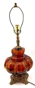 lot 28 image: Amber Glass Pumpkin Lamp with Ornate Brass Base