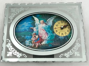 lot 296 image: Light up Angel Motif Oval Wall Clock with Silver Frame & Quartz Movement