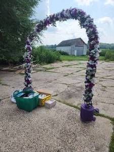 lot 34 image: Wedding arch and bin of decor