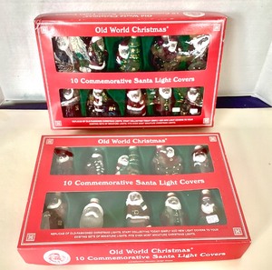 lot 28 image: Old World Christmas Glass Santa Light Covers