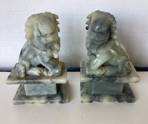 lot 73 image: Pair of Carved Stone Foo Dog Bookends  Trio of Bone Ivory African Carvings