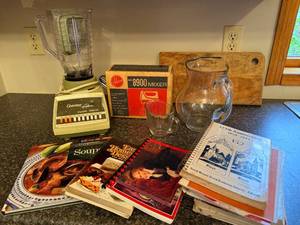 lot 41 image: Vintage Osterizer Galaxie Blender, Hoover 8900 Mixer, Cookbooks, and Glassware Assortment