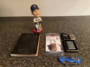 lot 61 image: Miscellaneous Collectors Group Harmon Killebrew Bobblehead, Vintage Book, Security Lock, Lighters, and Multi-Tool