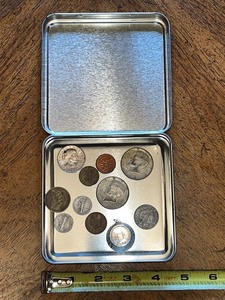 lot 10 image: Assorted Vintage and Foreign Coins in Metal Holiday Tin