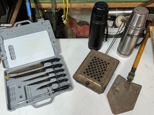 lot 10G image: Camping and Outdoor Lot Knife Set, Vintage Thermoses, Shovel, and Camp Stove