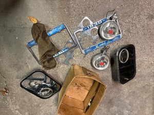 lot 63G image: 1930 Ford Model A License Plate Frames, Mirrors, and Fog Lights Set