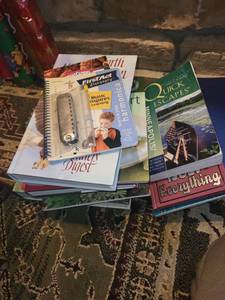 lot 113 image: Collection of Books and Harmonica Including Field Guide, Gardening, and Travel