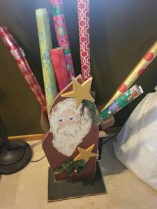 lot 116 image: Collection of Holiday Wrapping Paper Rolls and Wooden Santa Holder