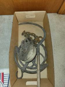 lot 134 image: Antique Cast Iron Barn Pulley with Hook, Chain, and Handle