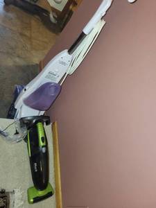 lot 144 image: Bissell QuickSteamer Upright Carpet Cleaner and Shark Cordless Vacuum