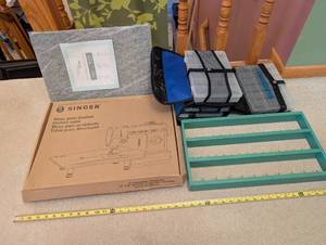 lot 6U image: Quilting and Sewing Supply Lot with Wool Pressing Mat, Singer Quilting Table, Storage Cases and Thread Rack