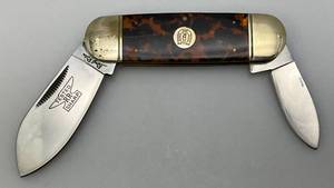 lot 76 image: Vintage Rough Rider Double Blade Pocket Knife With Amber Handle 2 & 3 Blades
