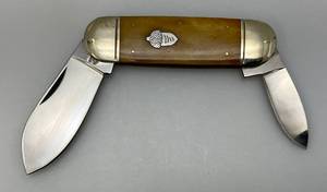 lot 77 image: Vintage Rough Rider Double Blade Pocket Knife With  Tan Handle  2 & 3 Blades