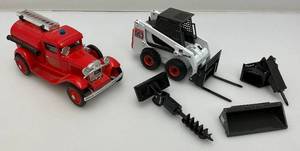lot 102 image: Limited Edition Die Cast Pumper Fire Truck Bank And Miniature Die Cast Bobcat 863 With Attchments