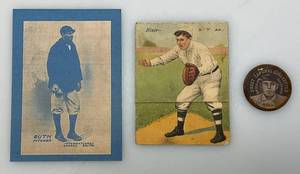 lot 126 image: Antique Cigarette Co. Collectibles Including 1914 Babe Ruth Rookie Card Reproduction, Walter Blair (Has Crease) & Domino Bell Coin (Rusty)