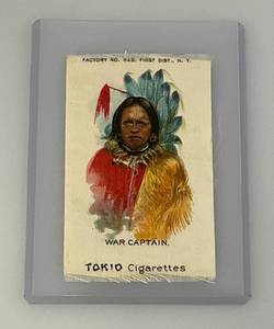 lot 128 image: 1910 Silk Tokio Cigarette Card War Captain Native American Adorned (In Protective Sleeve)