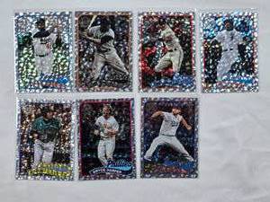lot 62 image: Lot of 7 2024 Topps Foil Inserts Featuring Jackie Robinson, Willie Mays, Carlos Correa, Frank Thomas, Ichiro, Bryce Harper, and Clayton Kershaw